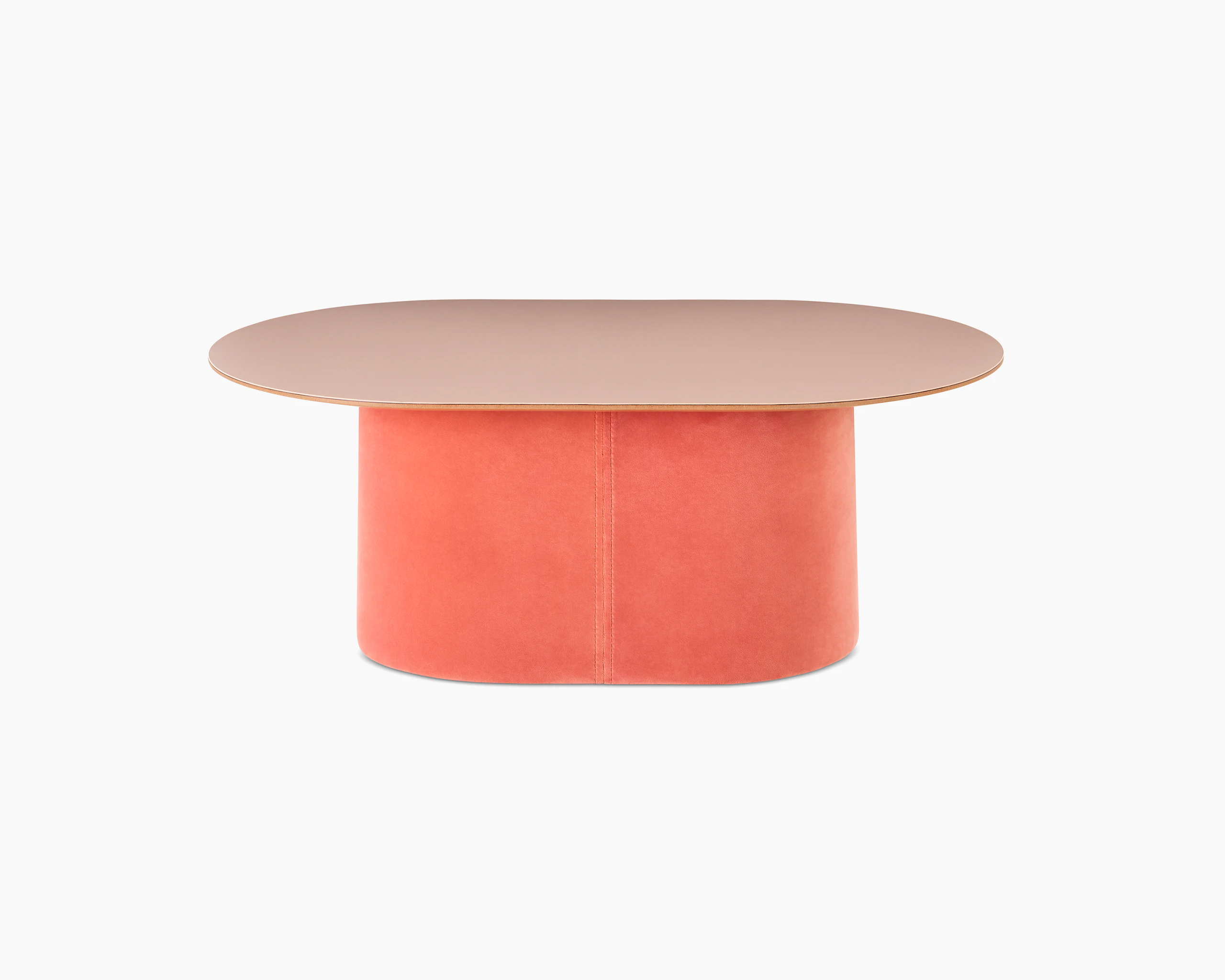 White sweep shot of Tun Coffee Table with a coral upholstered base and pale pink Forbo table top.