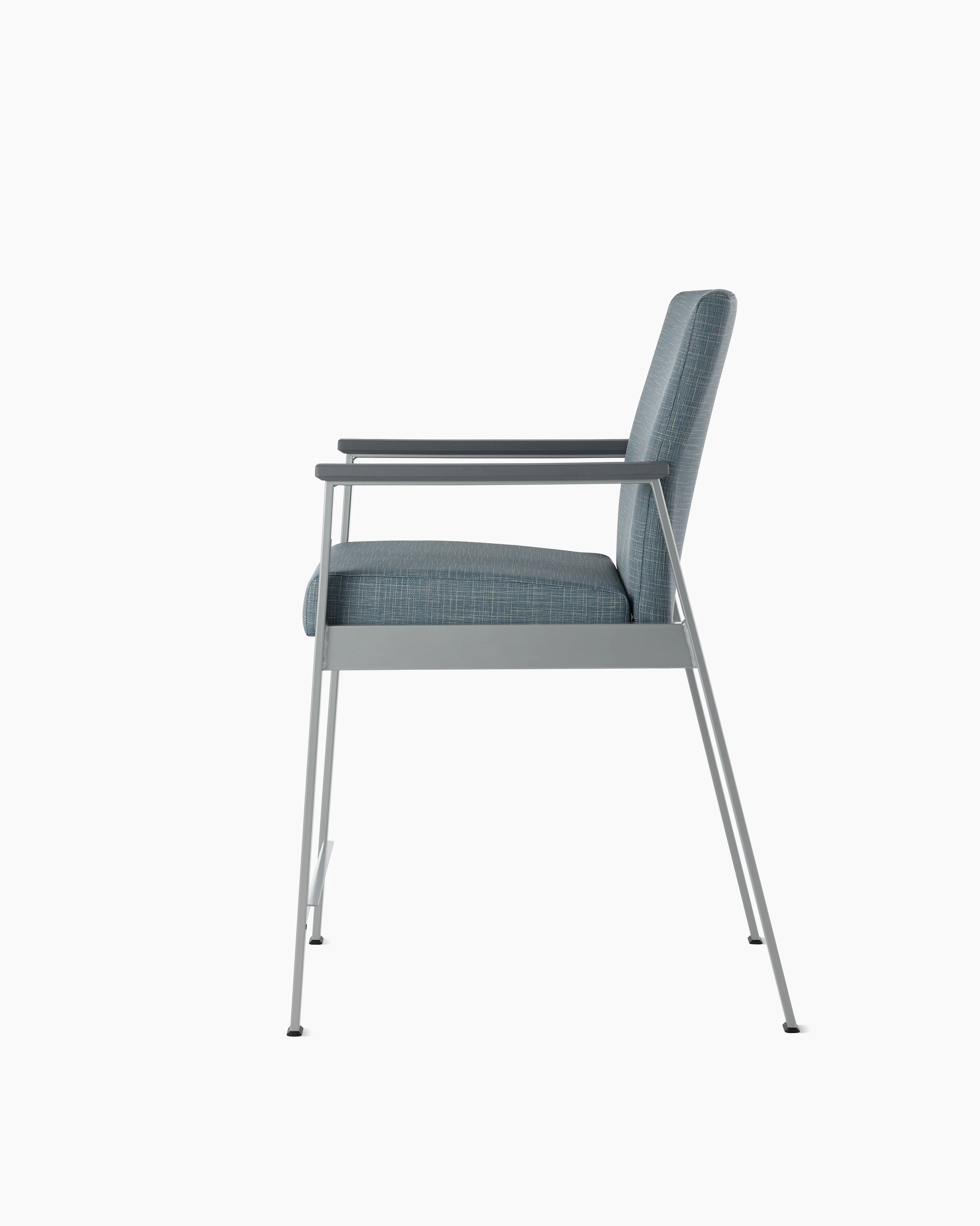 Side view of an Easton Easy Access Chair with blue upholstery, metallic silver four leg base and slate grey arm caps.