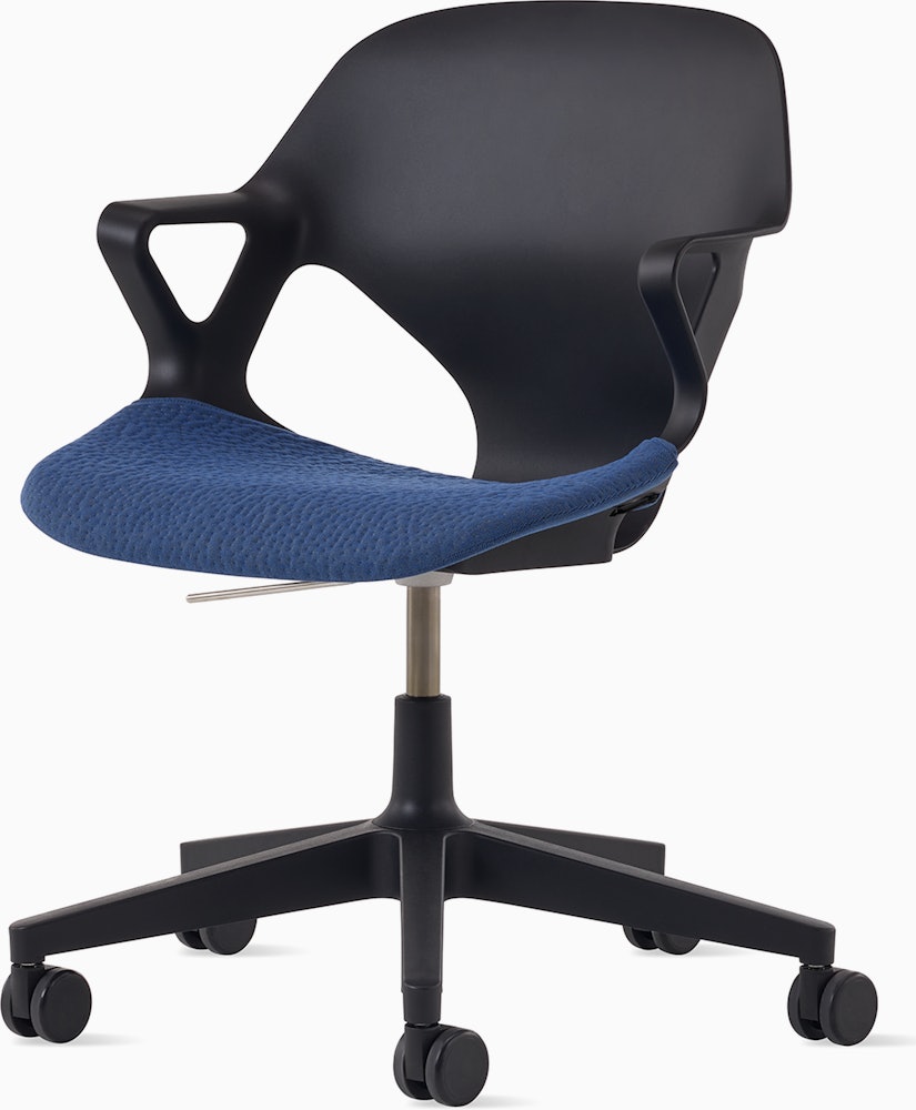 Front angle view of a black Zeph chair with fixed arms and a blue seat pad.
