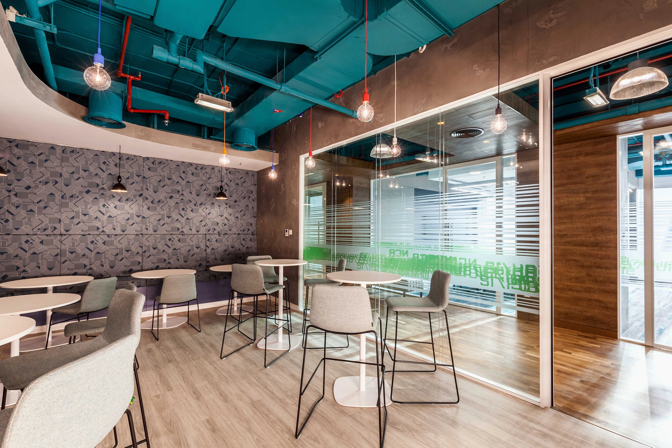 Café space with tables, chairs and stools.