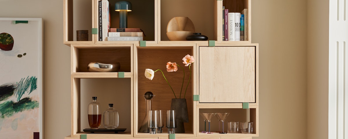 Stacked Storage System with various home accessories in a living room setting