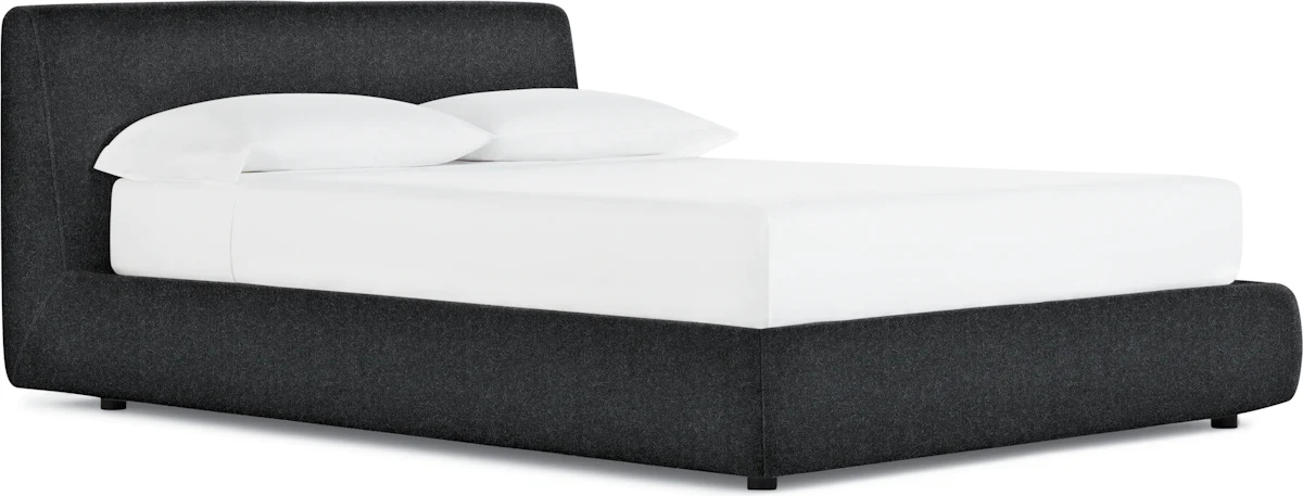 Modern platform bed with gas-lift storage ottoman in base, mattress removed displaying under-bed storage
