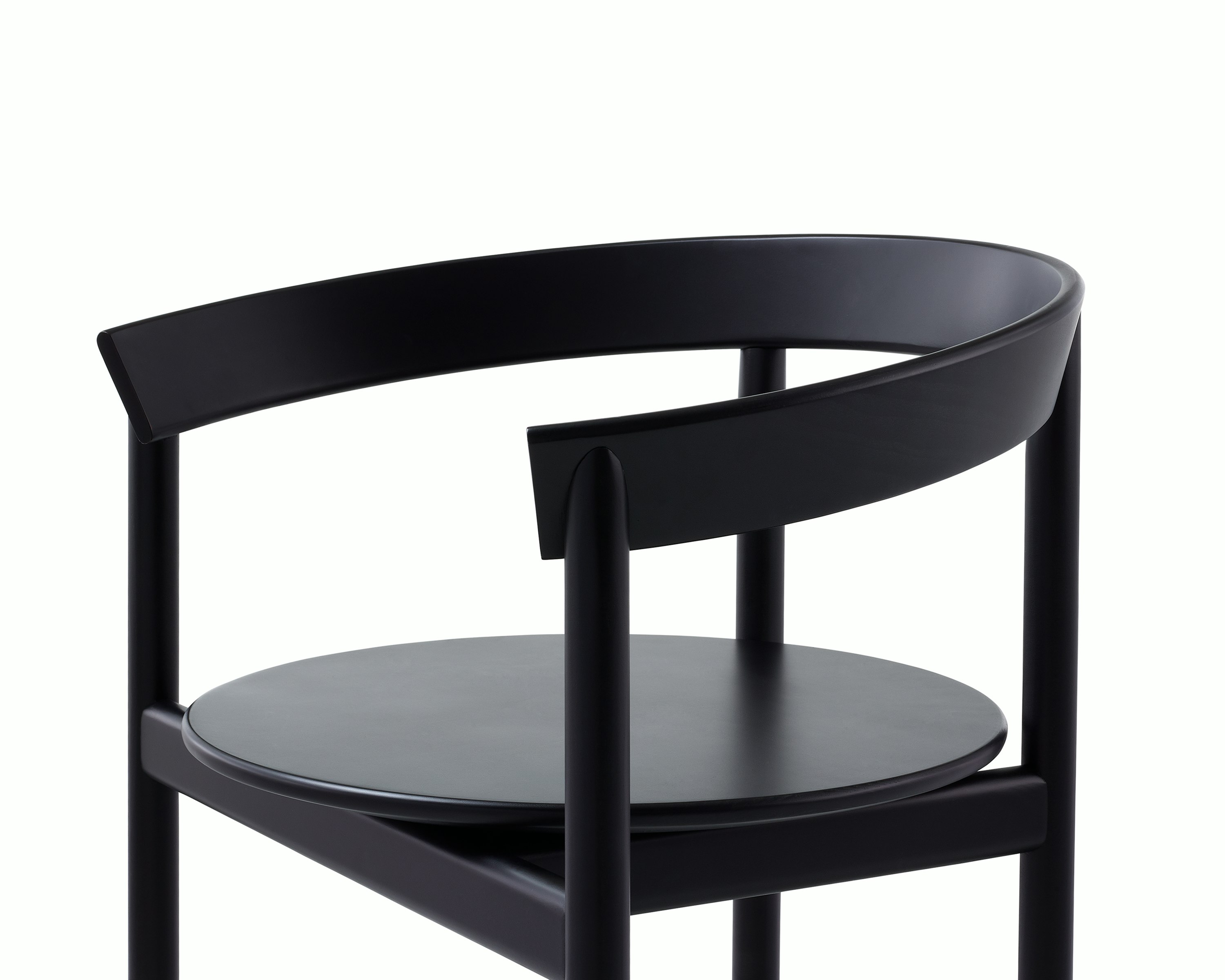 Detail shot of a Comma Chair with arms highlighting the solid frame.