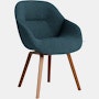 A front angle view of the AAC 123 Soft About A Chair Upholstered Armchair with a wood base.