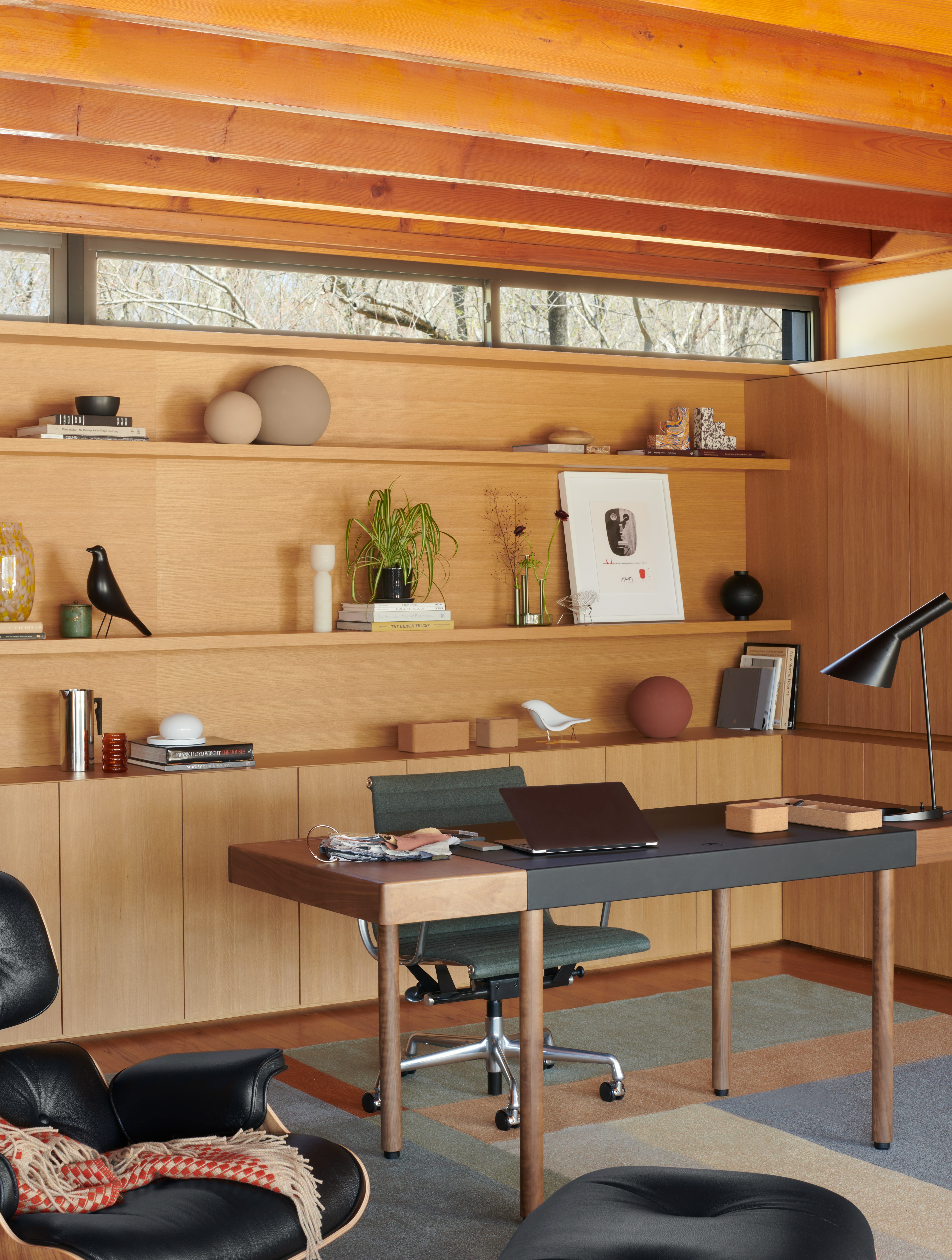 Leatherwrap Sit-to-Stand Desk,  AJ Table Lamp,  Landscape Rug,  Eames Lounge and Ottoman,  Kristina Dam Studio Globe Sculptures,  Bolita Table Lamp,  Eames House Bird,  Nelson Face Print,  Eames Aluminum Group Chair