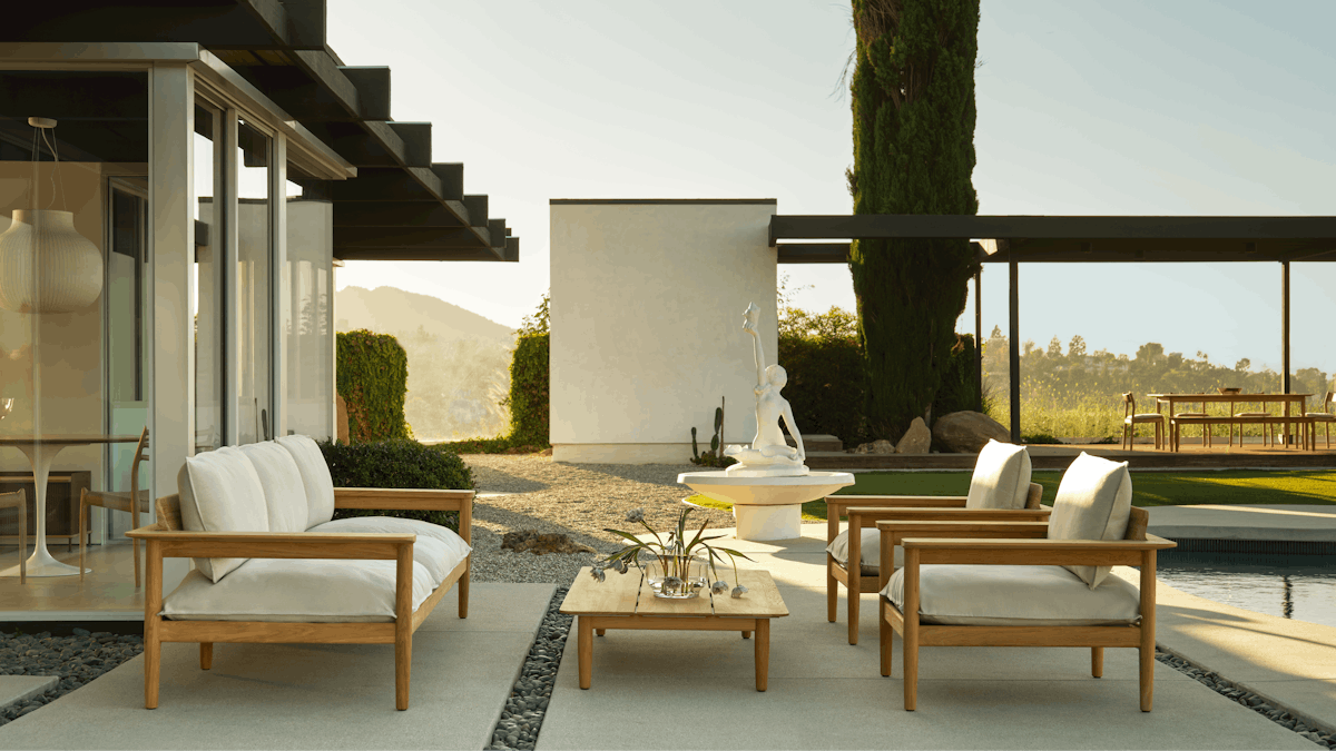 Terassi Lounge Chair, Sofa and Coffee Table on a patio in a poolside setting