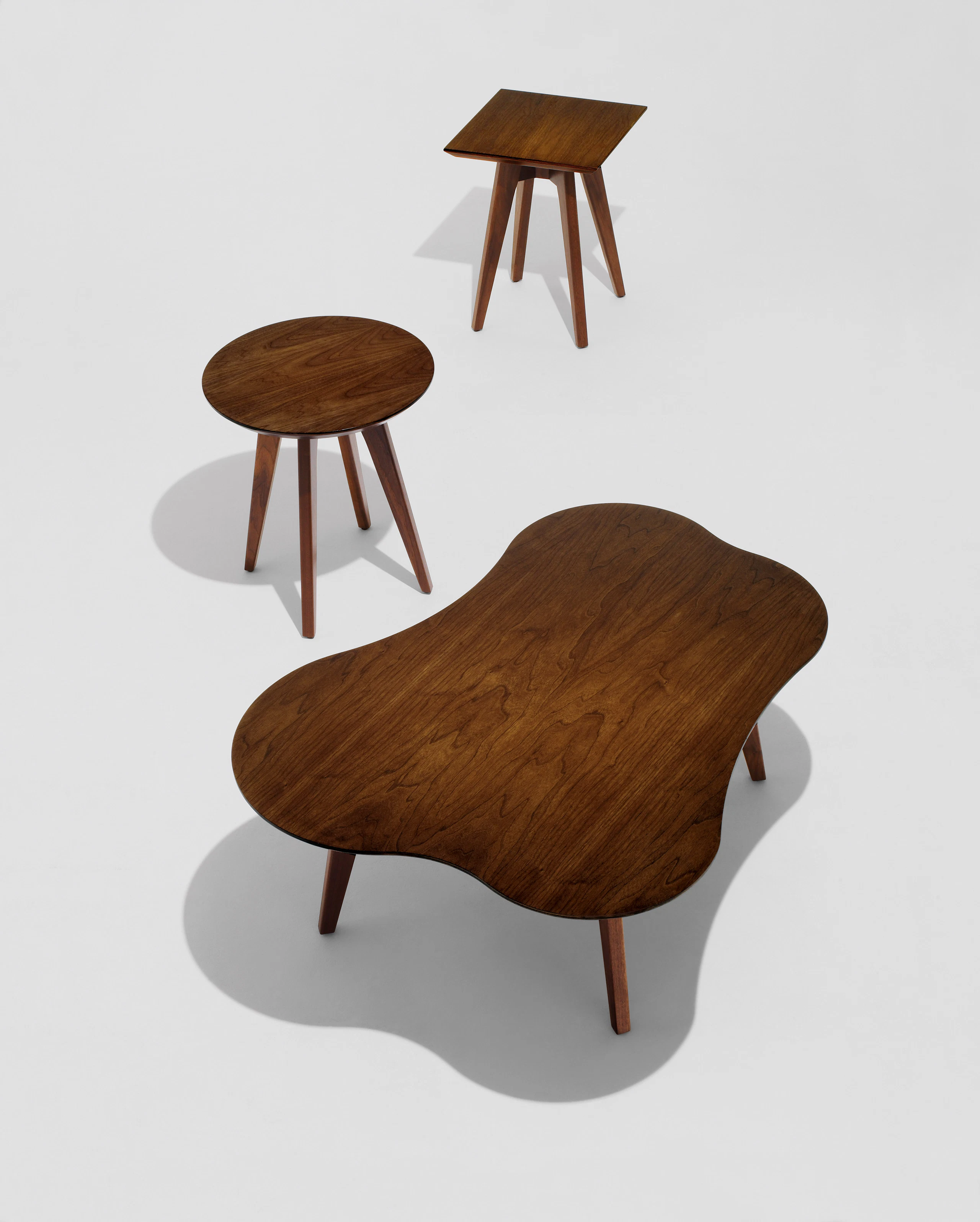 Risom Square; Round and Amoeba side tables in light walnut wood