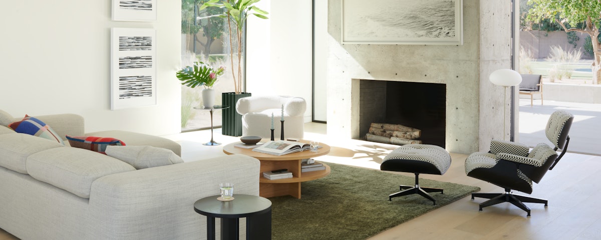 Stemlite Floor Lamp, Kelston Sectional, Eames Lounge and Ottoman, Huggy Swivel Chair, Ruti Moroccan Wool Rug, and Risom Low Table in living room setting