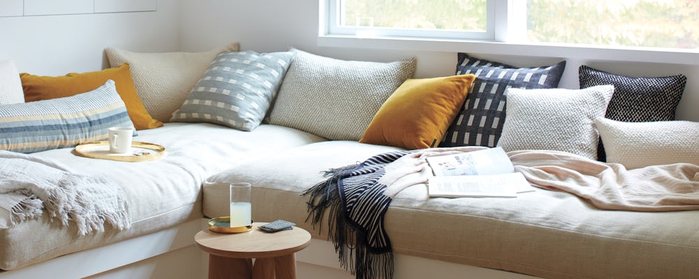 Assorted Throw Pillows in a home reading nook setting