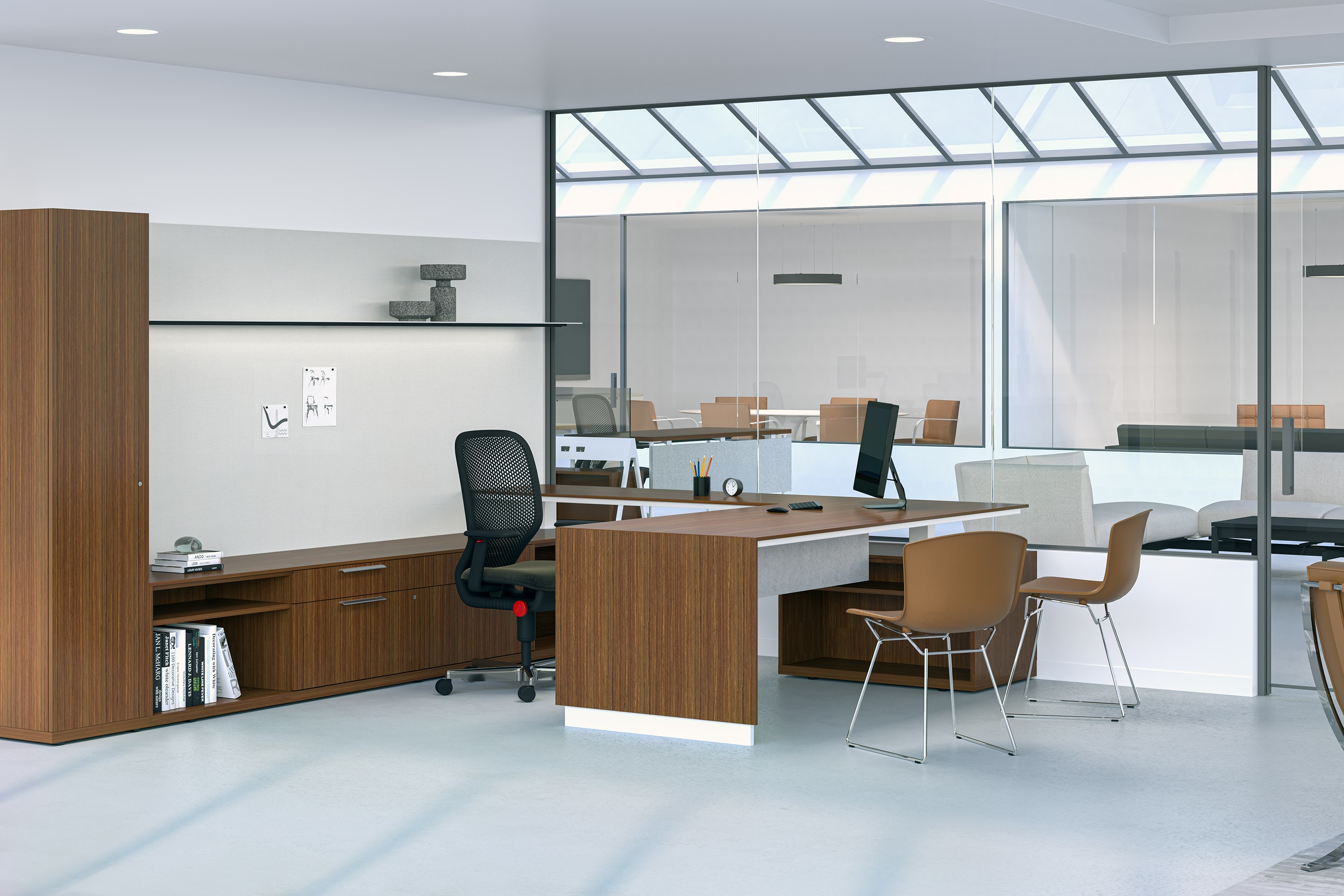 A private office featuring a l-shaped height-adjustable table, workwall, shelf and credenzas in a medium brown premium wood veneer finish.