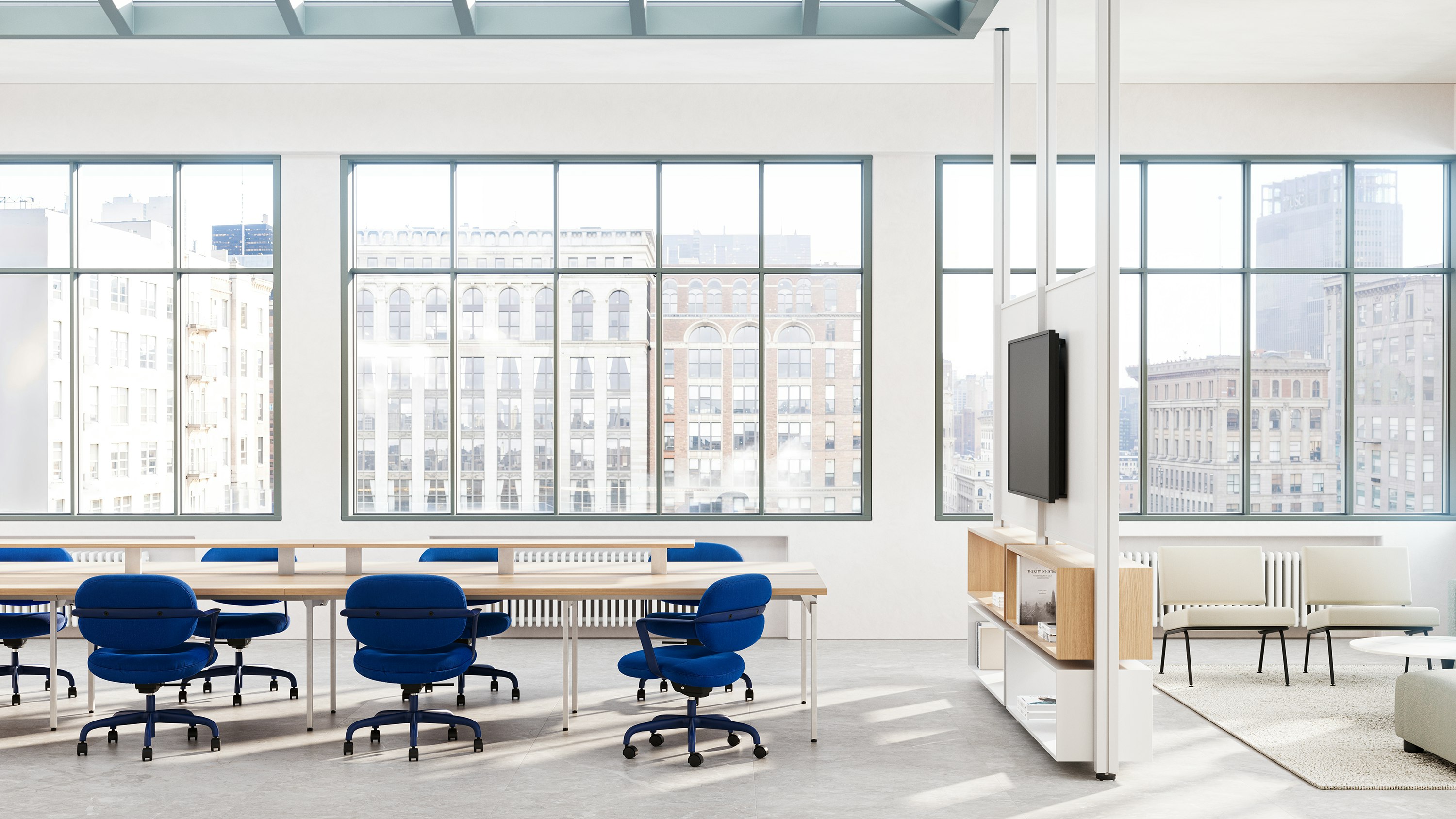 Eight blue Morrison Hannah chairs surround a table in an open collaborative space.