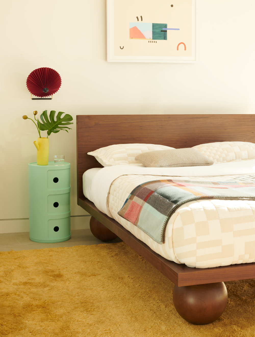 Yoko Bed, Matin Wall Sconce,  and Componibili Bio Storage Unit in a bedroom setting