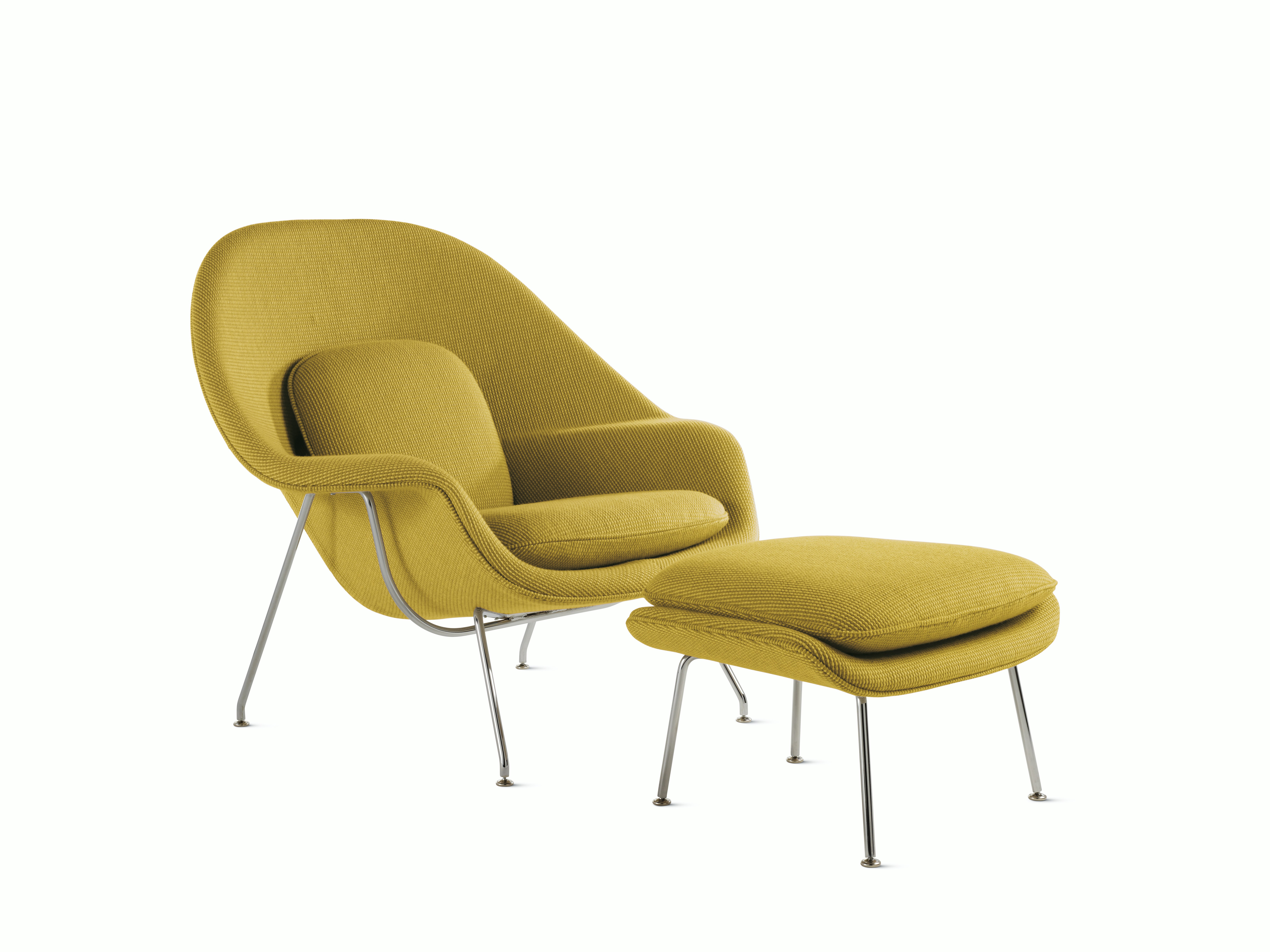 A green Womb Chair & Ottoman viewed from an angle