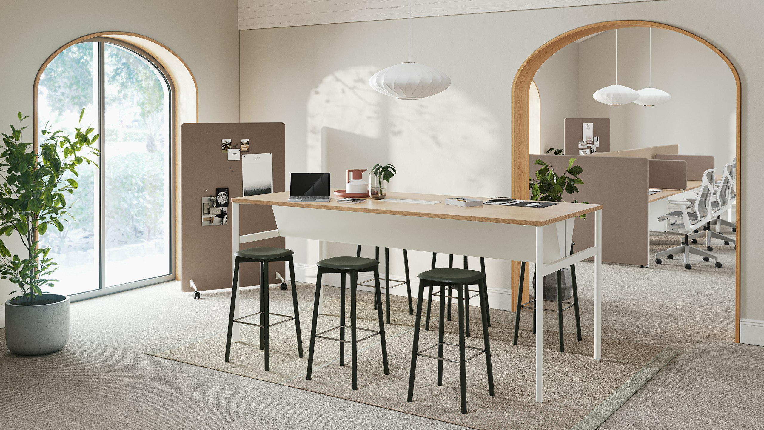 A bright office meeting room with an OE1 Communal Table and brown Bound Mobile Screen and workstations with brown Bound Screens and Cosm Chairs in the background.