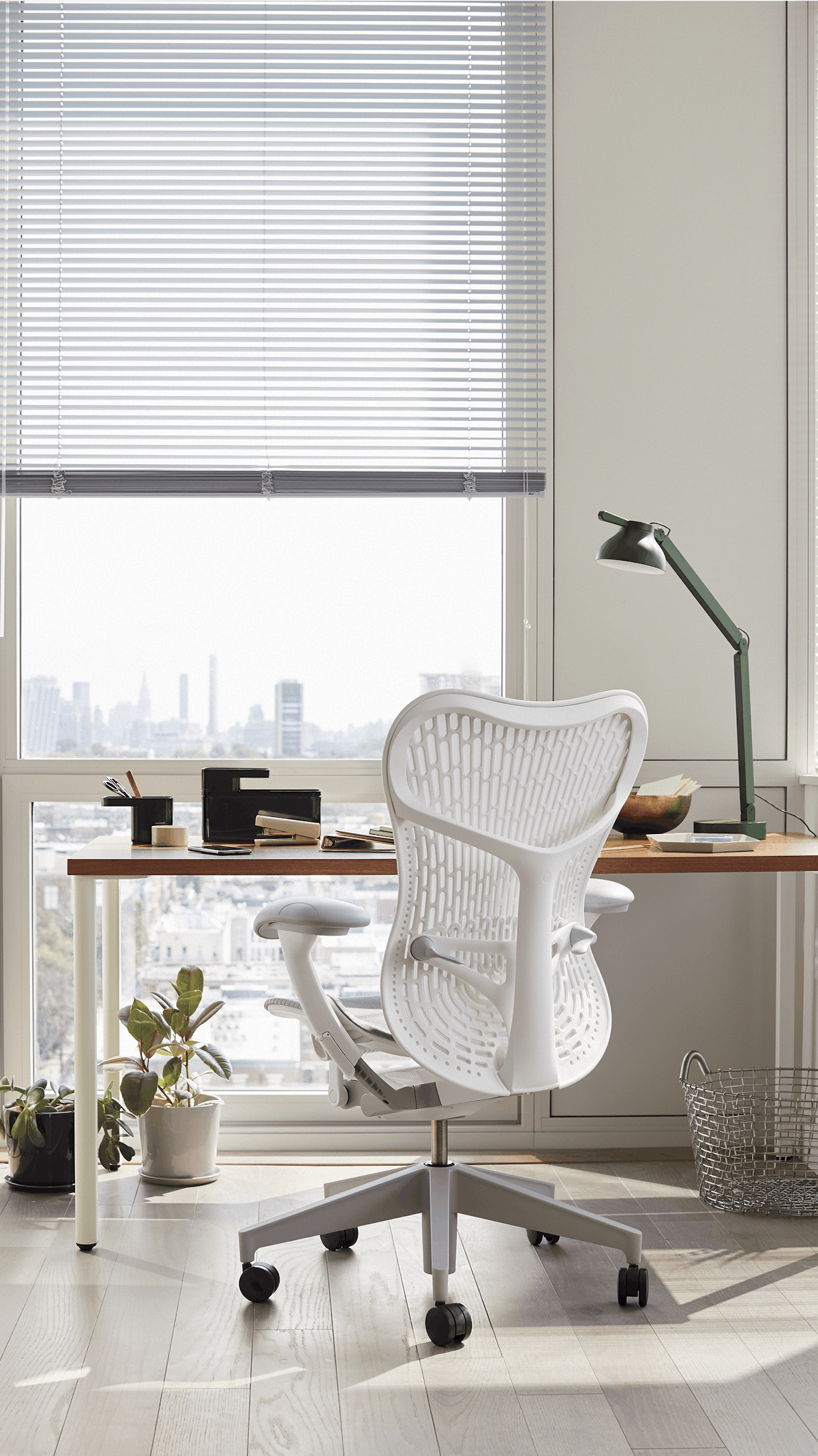 Grey and white Mirra 2 chair with brown and white OE1 Rectangular Table in a home office setting.