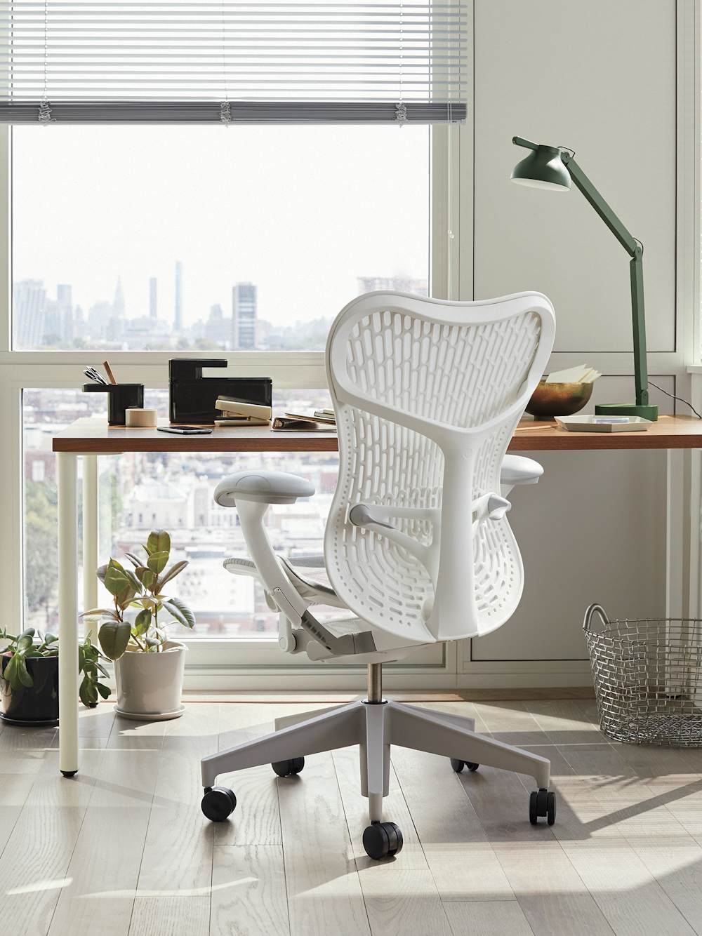 Grey and white Mirra 2 chair with brown and white OE1 Rectangular Table in a home office setting.