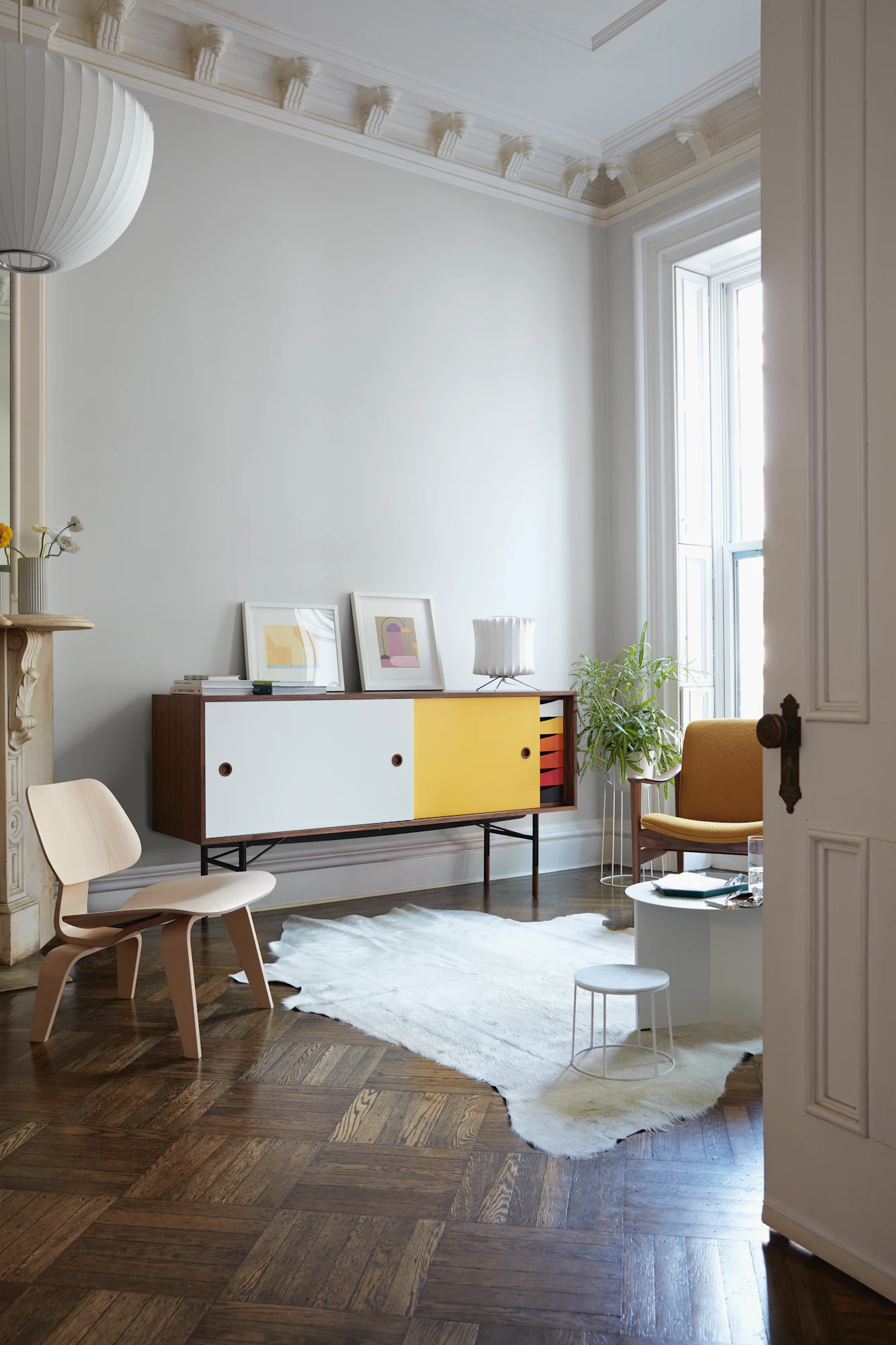 Walnut credenza with colorful doors and drawers in bright room