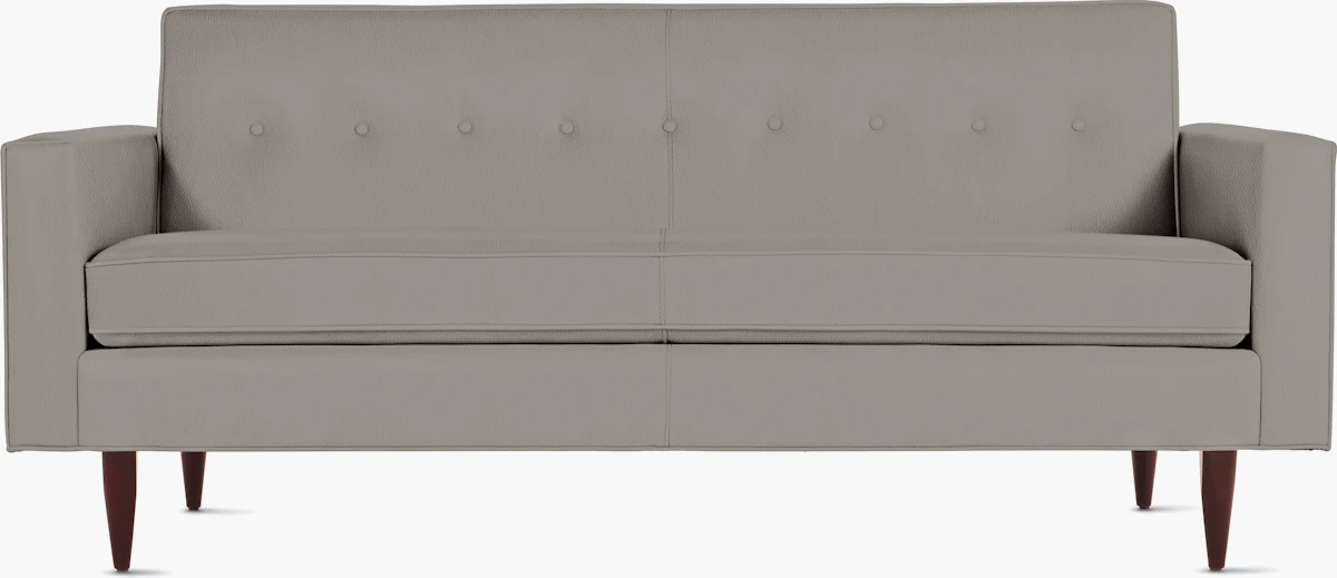 Light gray mid-century modern sofa with wooden tapered legs and two seat cushions.