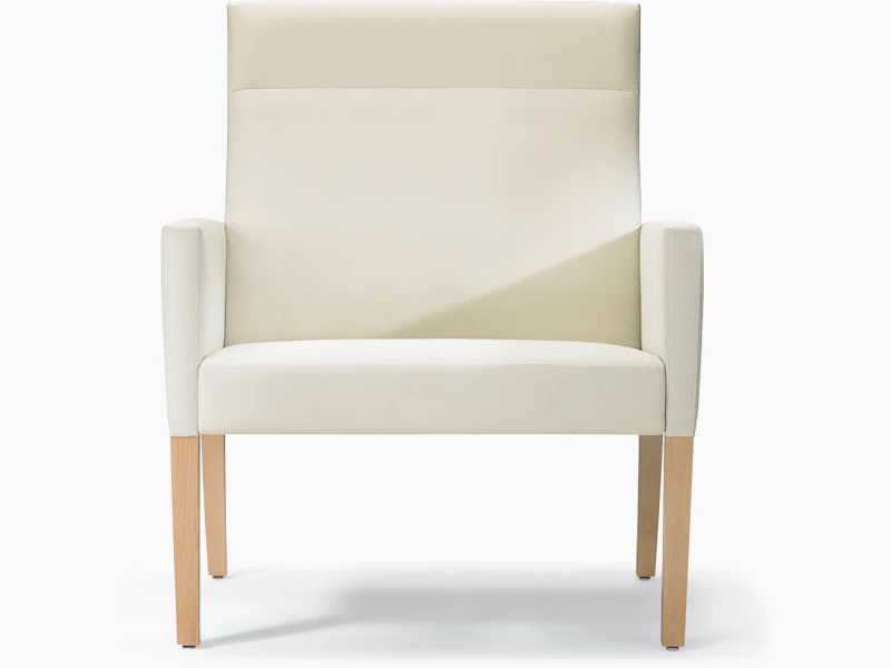 A front view of a Brava 862 Plus Patient Chair with high-back in white textile with upholstered arms and maple base.