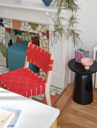 Risom Counter Stool in brownstone with colorful fireplace