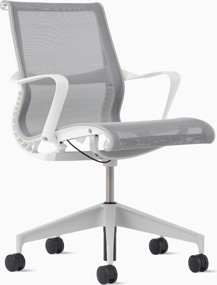 Front angle view of a Setu chair with grey suspension, white frame and silver alloy base.