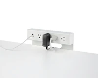 USB-A port and cable, USB-C port, and four A/C power outlets with two cables plugged into an attached table power source.