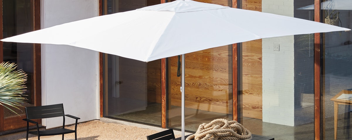 Tuuci Ocean Master Rectangular Shade with EOS Communal Table in an outdoor patio setting