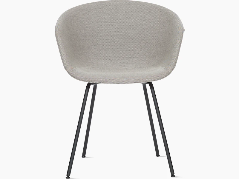 A front view of the AAC 27 About A Chair upholstered armchair with a metal base.