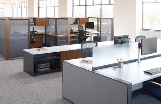 Dividends Skyline worksurfaces height panels used in a benching application with double depth credenzas