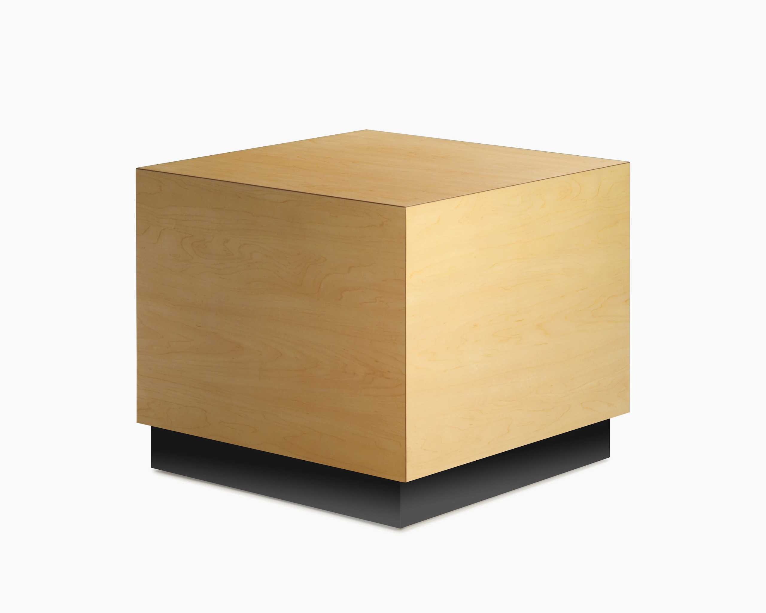 Cube Table in a honey maple finishe and a black plinth base, viewed at an angle.