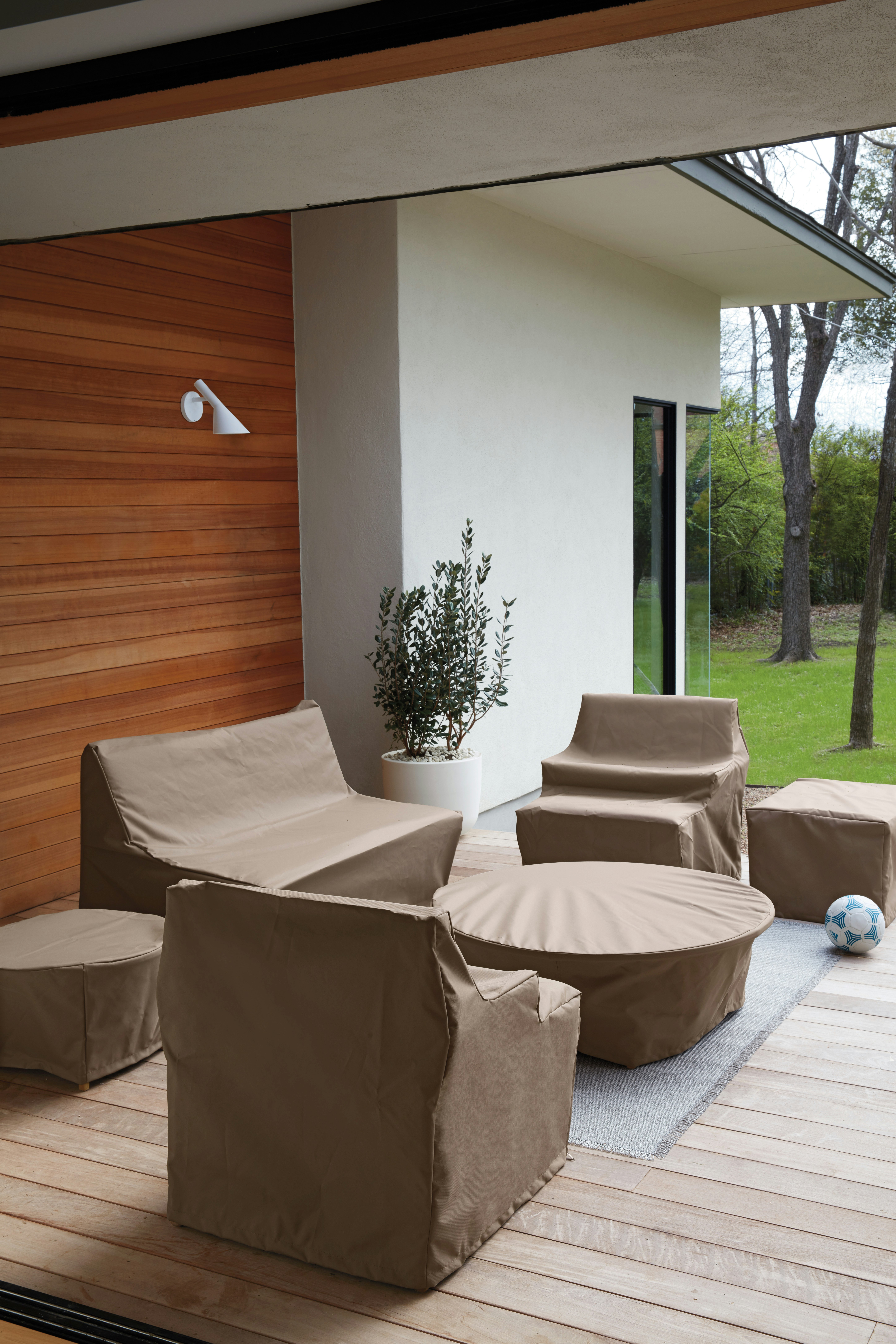Eos Outdoor Furniture under Eos Table Covers in an outdoor patio setting