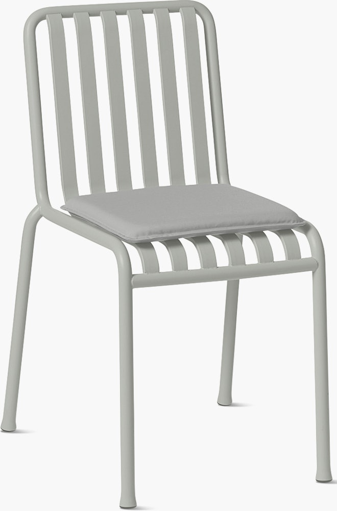 Three quarter view of a Palissade Side Chair Seat Pad in light grey.