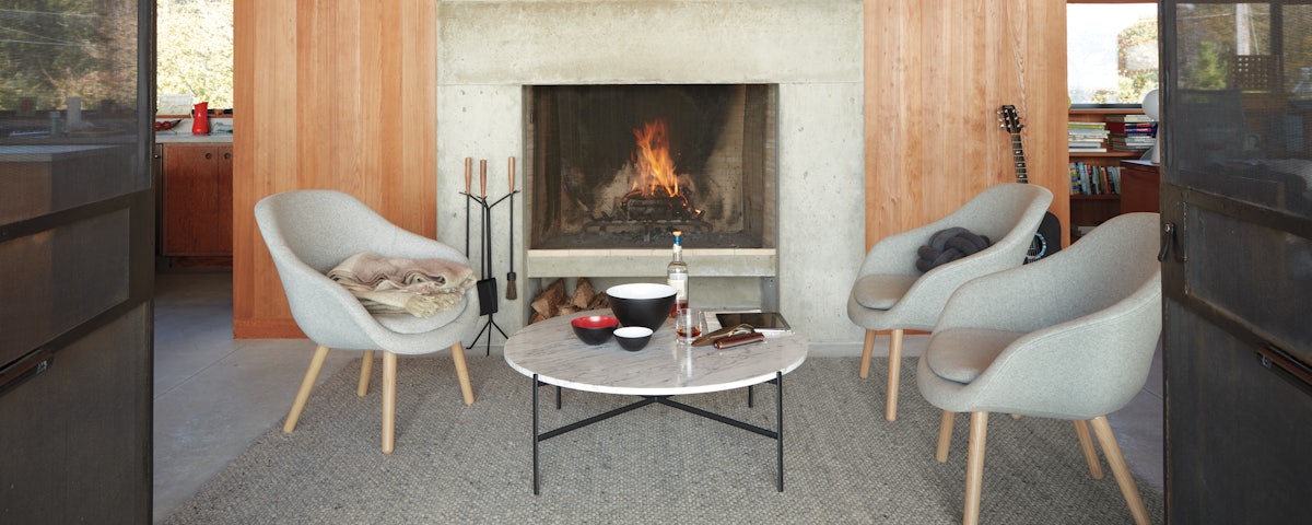 About A Lounge 82 Armchairs in front of a fireplace in a living room setting