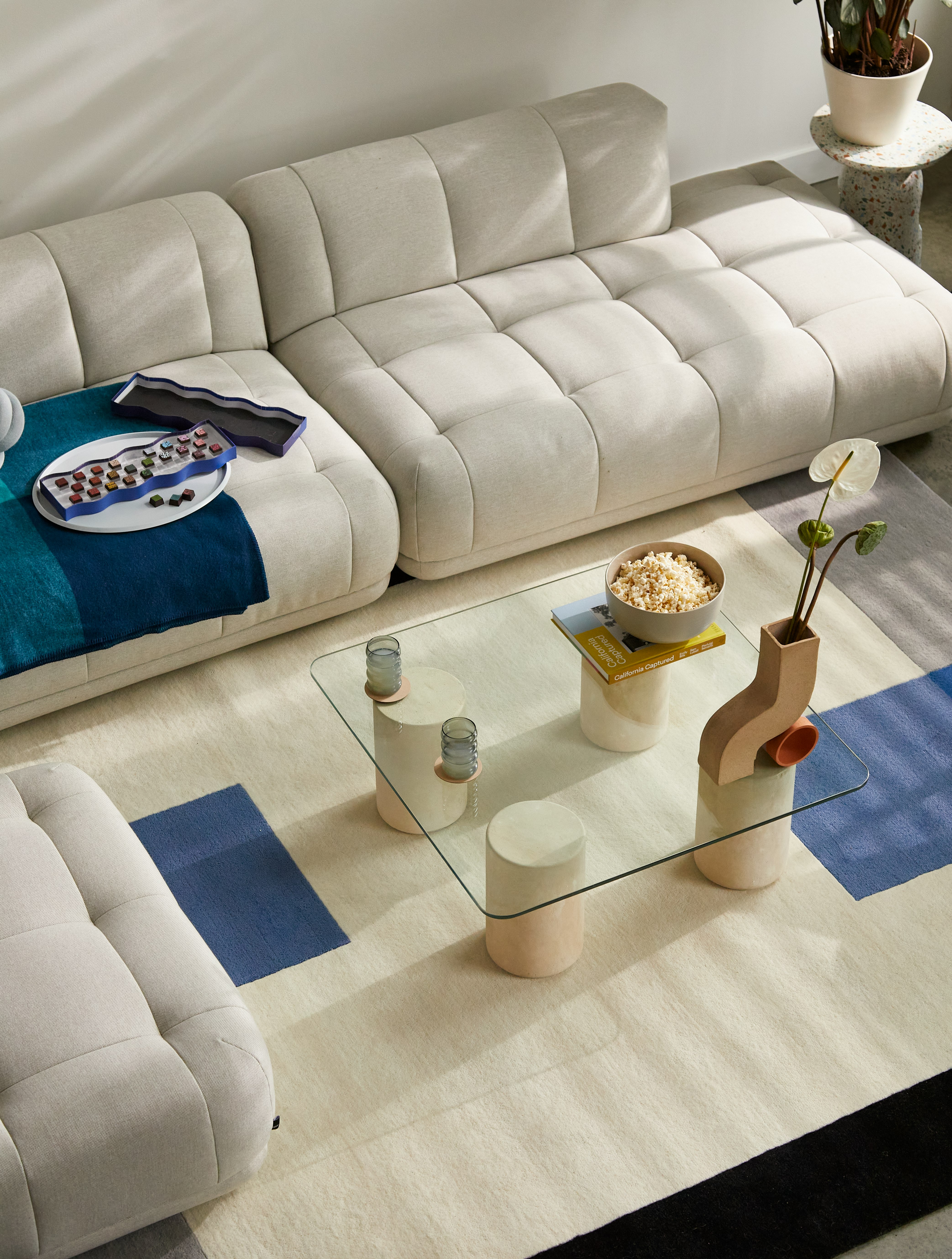 Quilton Sofa and Ottoman,  Knot Cushion,  Girard Throw,  Ripple Glasses,  Tide Coffee Table,  Doline Vase,  and Ellipse Tray