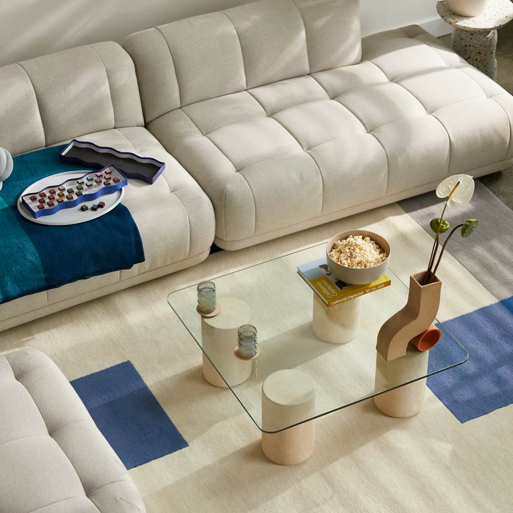 Quilton Sofa and Ottoman,  Knot Cushion,  Girard Throw,  Ripple Glasses,  Tide Coffee Table,  Doline Vase,  and Ellipse Tray