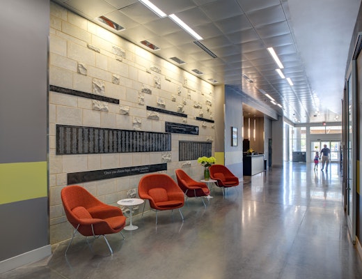 St. Francis Cancer Center at Millenium healthcare lounge Eero Saarinen Womb Chair Saarinen Pedestal Table outpatient facility hallway