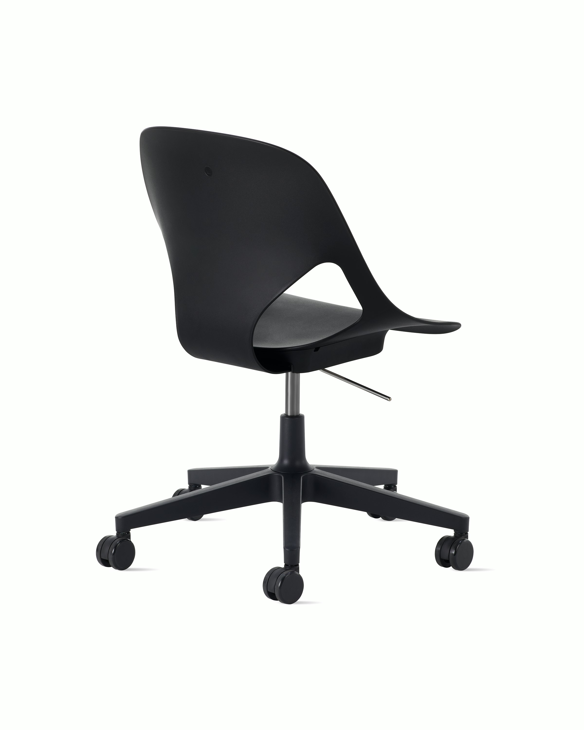Rear angle view of a black armless Zeph chair.