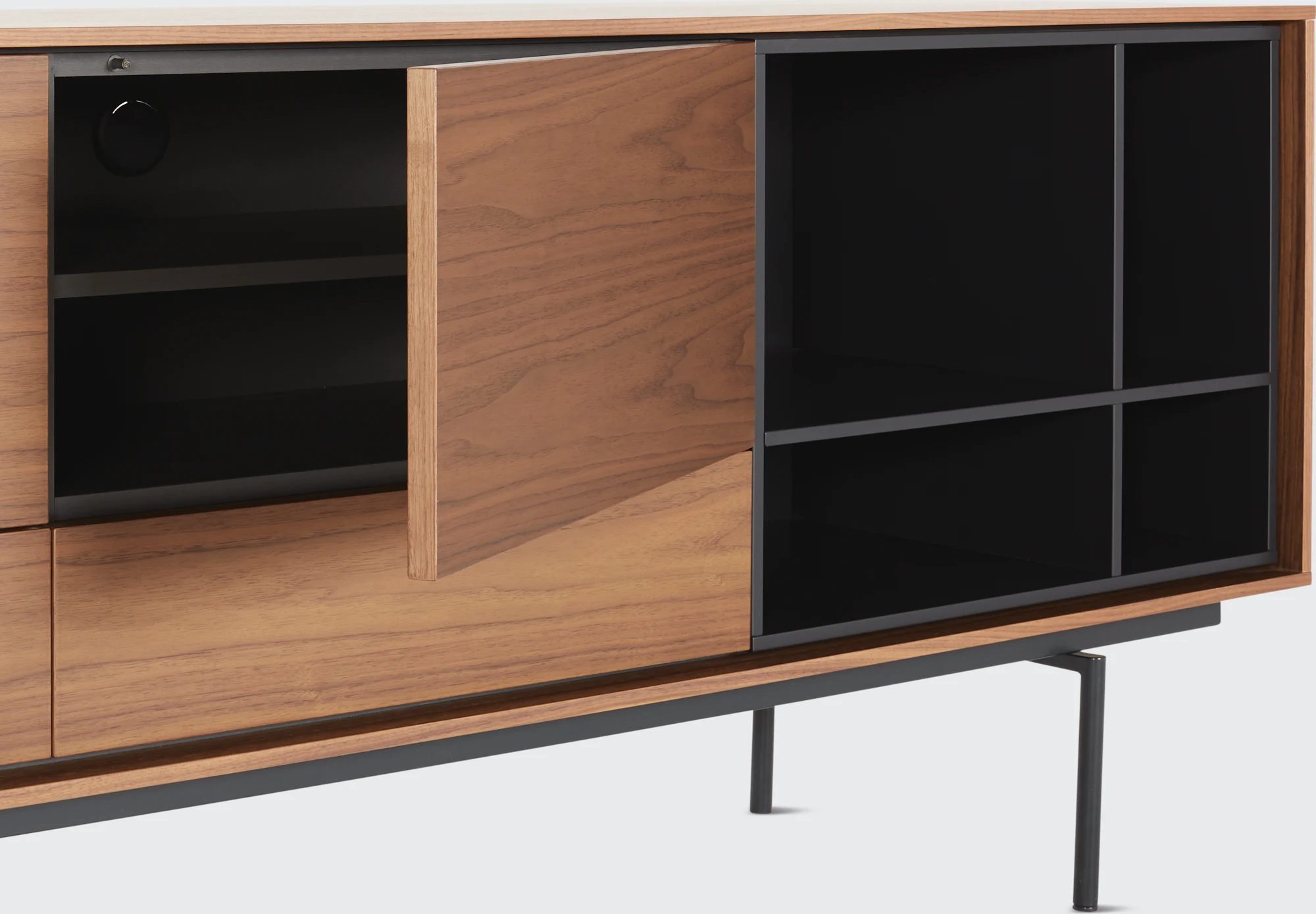 Aura credenza open compartments showing oak panels and dark interior