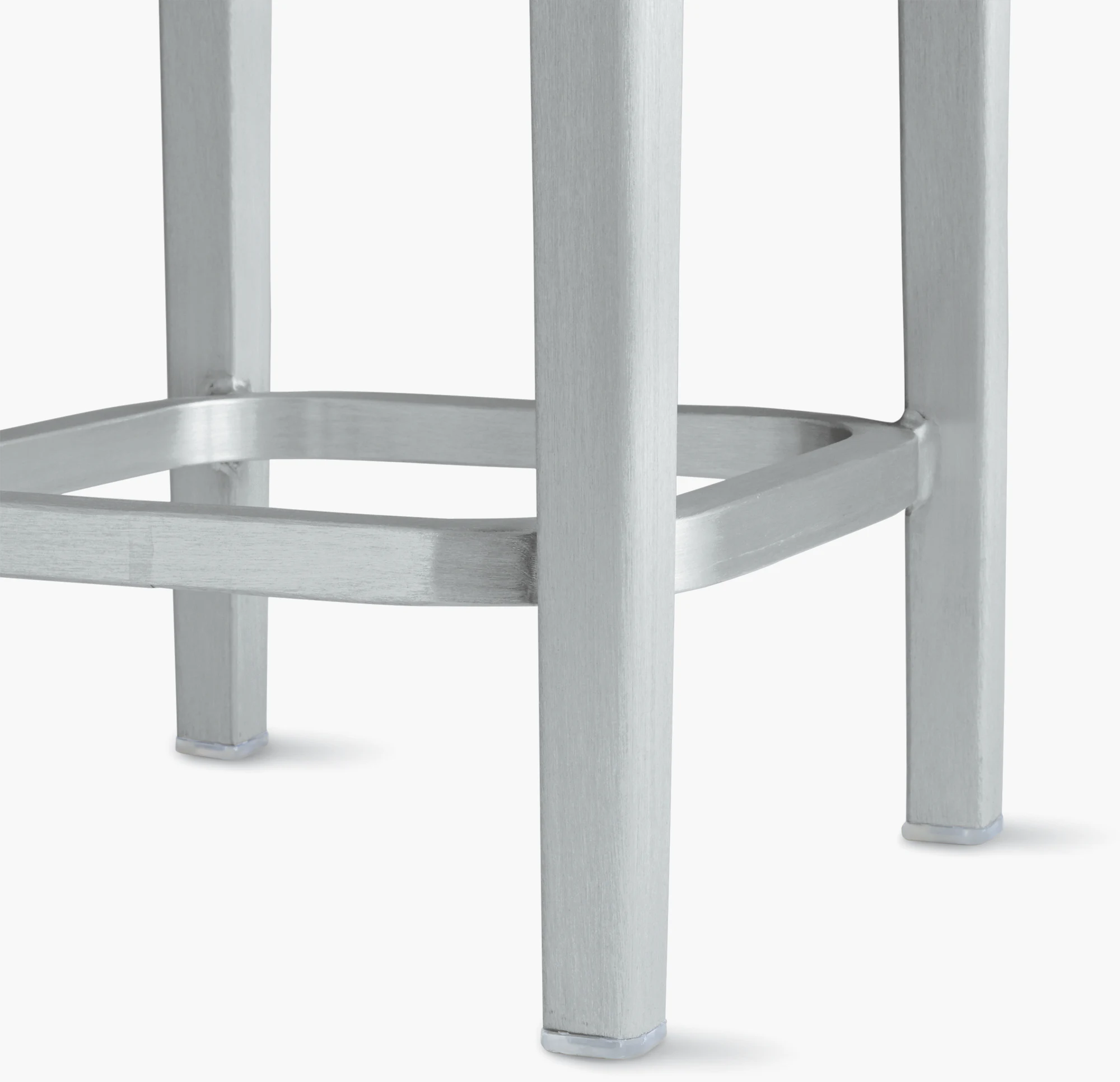 Emeco stool frame detail with brushed metal legs and crossbars