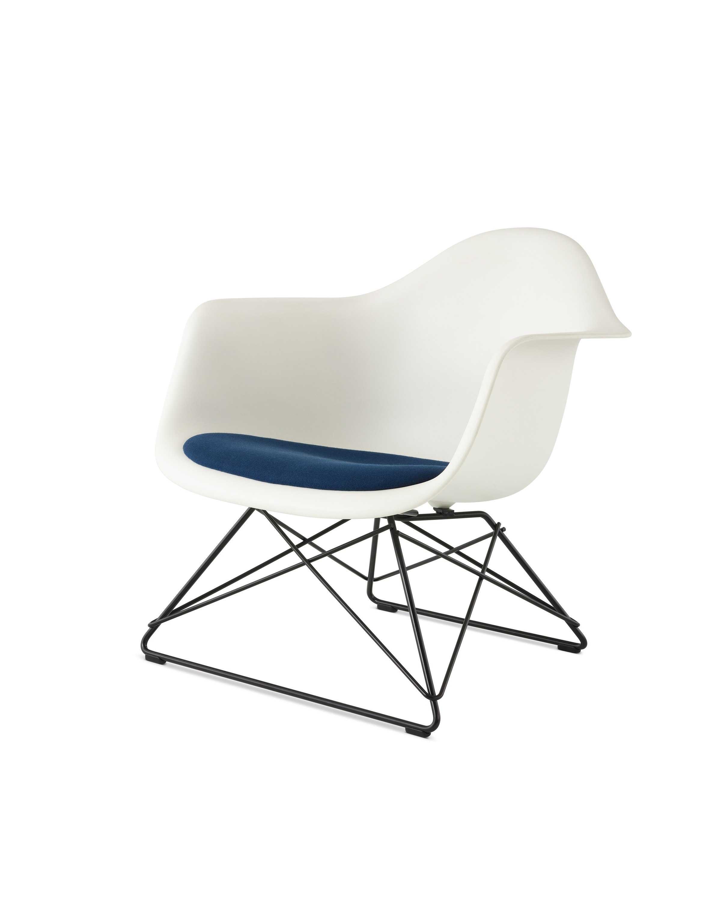 An Eames Molded Plastic Armchair with a seat pad and low wire base, viewed at an angle.