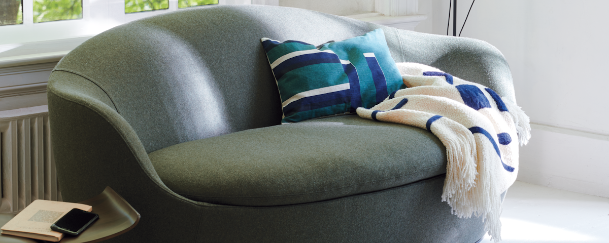 Lina Sofa with blankets in a living room setting