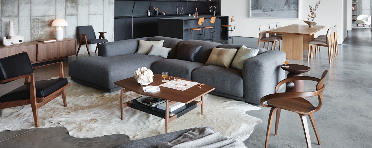 Cowhide Rug under Outline Rectangular Coffee Table in front of Raleigh Sofa in living room setting