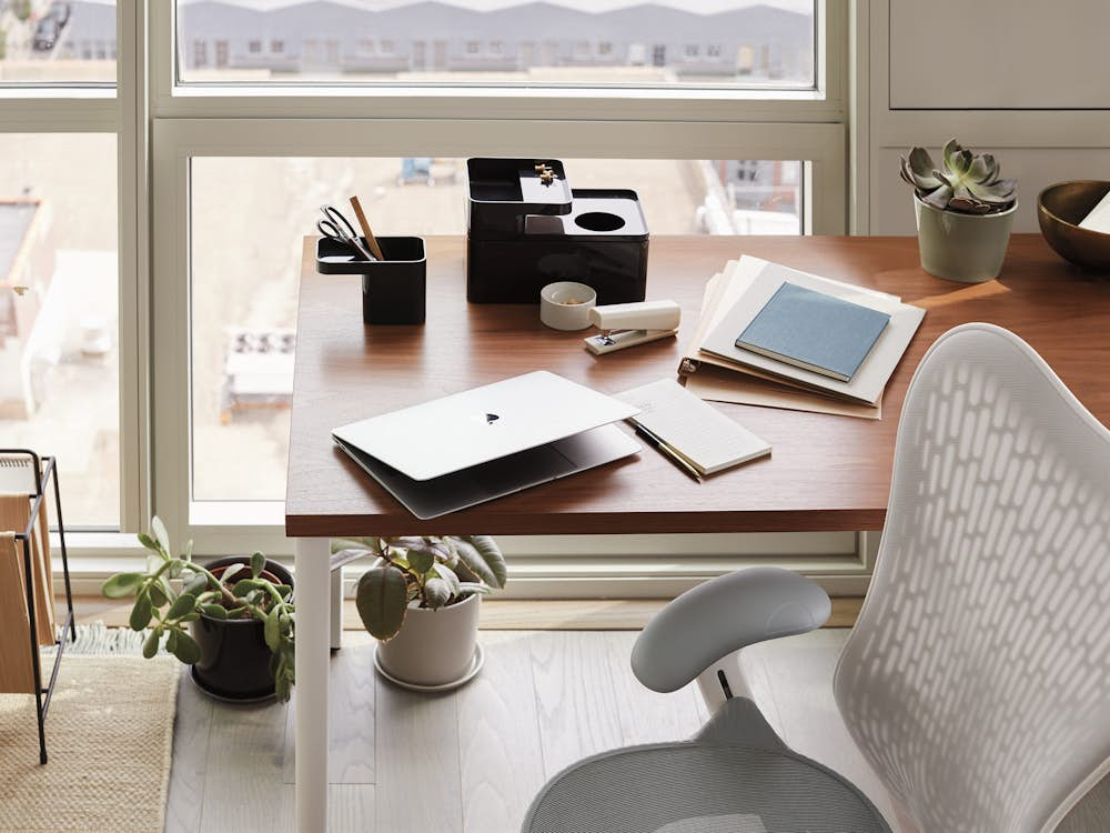 Grey and white Mirra 2 Chair with brown and white OE1 Rectangular Table in a home office setting.