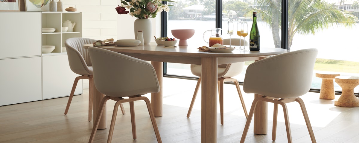 Four About A Chair 23 Armchairs around a dining table in a dining room setting