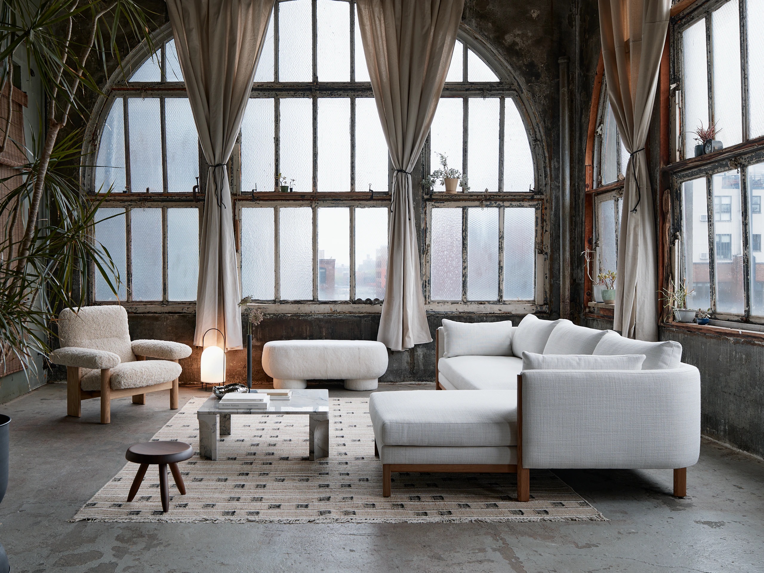 Emmy Sectional Chaise, Big Foot Bench, Brasilia Chair and Doric Table