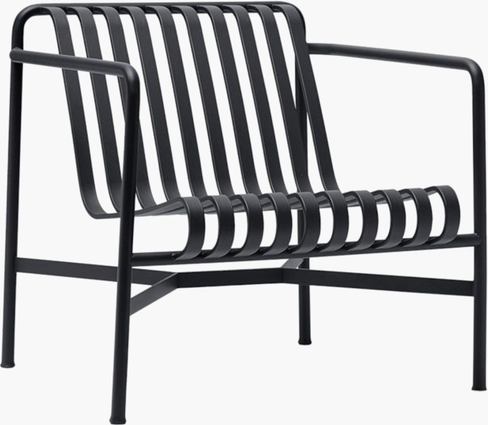 A three quarter view of a Palissade Lounge Chair, Low in dark grey.