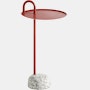 A front view of the Bowler Side Table in red with a granite base.