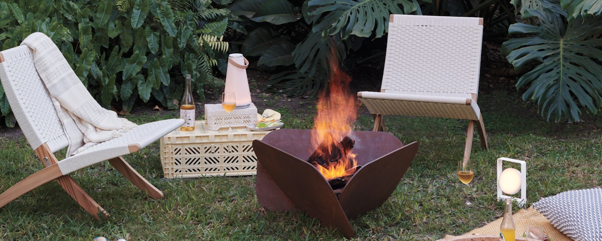 Cuba Outdoor Lounge Chair with Plodes Petal Fire Pit in outdoor setting