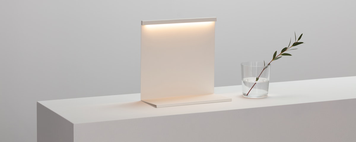 LBM Table Lamp next to water glass on counter