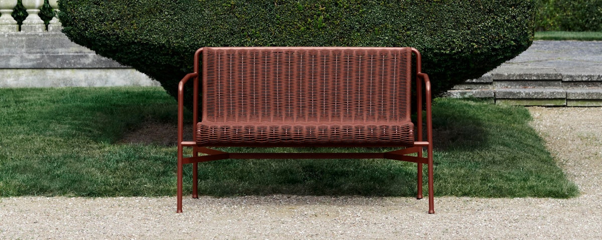 Palissade Cord Dining Bench in a grass lawn setting